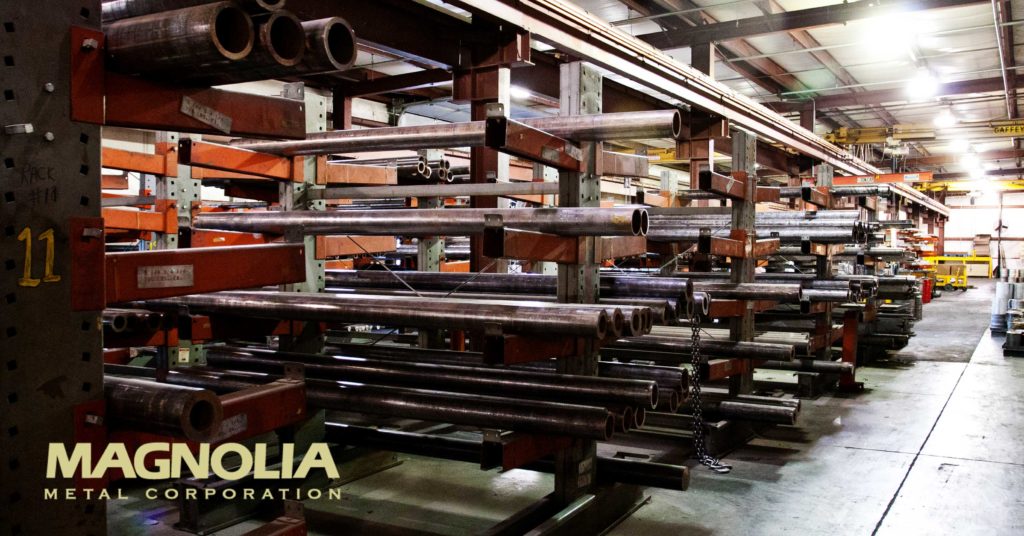 Metal tube stock stored on industrial racks inside Magnolia Metal’s warehouse.